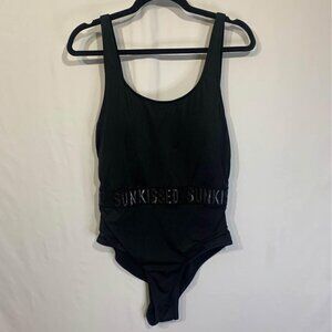 WOMAN’S one piece swimsuit. Black. “Sun kissed”. Gorgeous cut and flattering sty